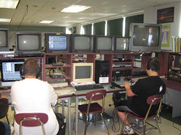  Ludlow High Schools Eye of the Lion TV Studio students work in the news room to produce a morning announcement show.