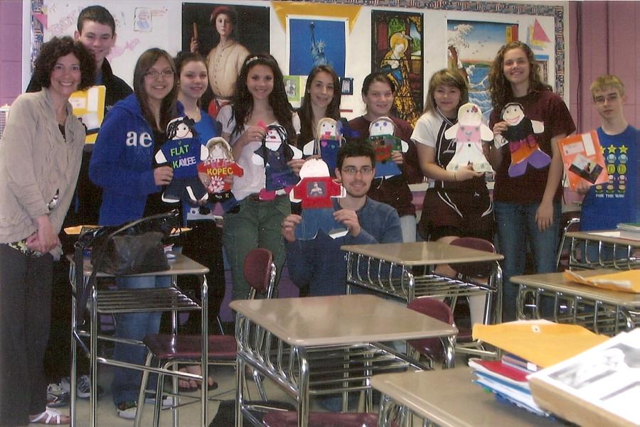 From left to right teacher Michelle Masse along with students Chris Barbeau, Katrina Kobus, Jessica Pashko, Alison Leecock, Taylor Graffum, Hannah Martin, Meghan LaPointe, Chris Evans, and Jon Royce pose with the Flat Stanleys.
