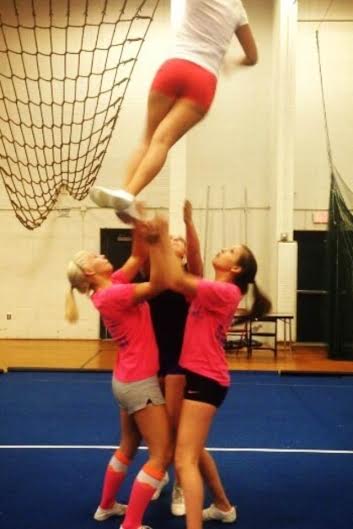 Megan Feuston and Kate Sweetman basing Emily Sajdak in a full twist with Theresa Gelinas as the back spotter