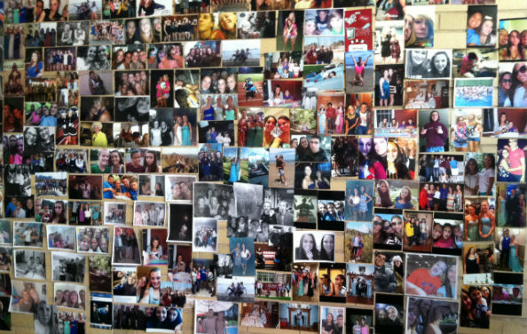 A wall of photos from a past Deck the Halls 