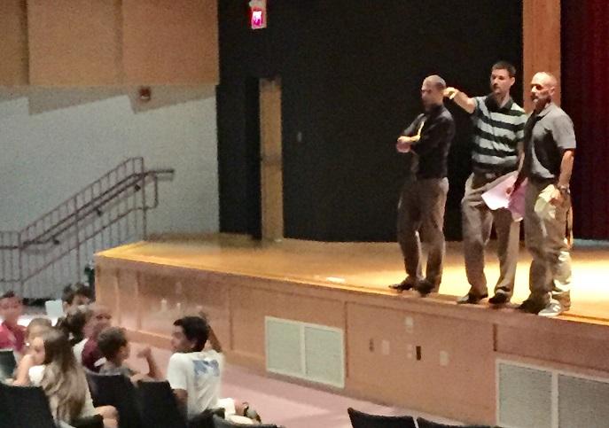 Left to right: English teachers Keith Woodman, Chris Rea, and Charlie Cangemi address the Class of 2019.