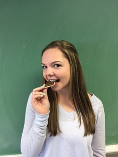 Lombardi munching on a gluten-free cookie.