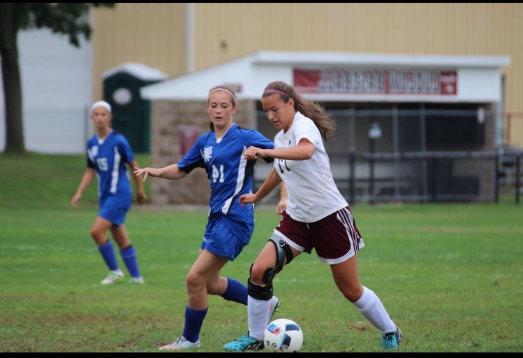 Silva, in her 2016 season, dribbling up the field against Westside