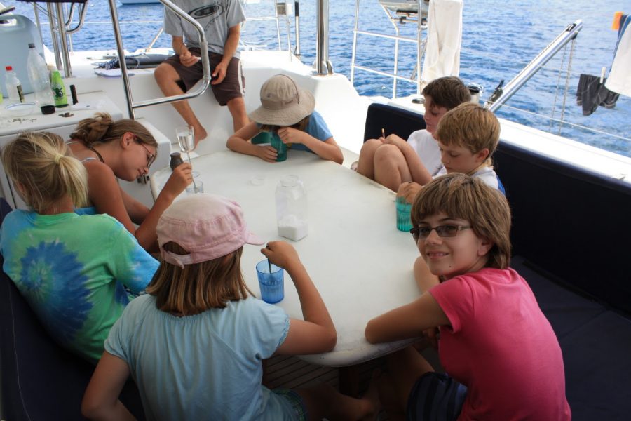 The author, Emily Lawler, in Chem class  on a boat while being home schooled.