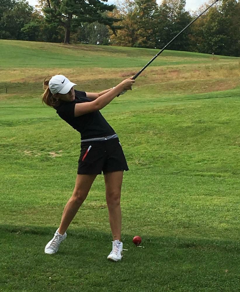 Keira Gay, the first female golf captain, tees off at the Ludlow Country Club.