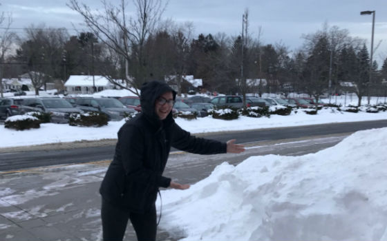 Senior Lauren Teixeira happily shows off the snow that resulted in a four-day weekend in early January.