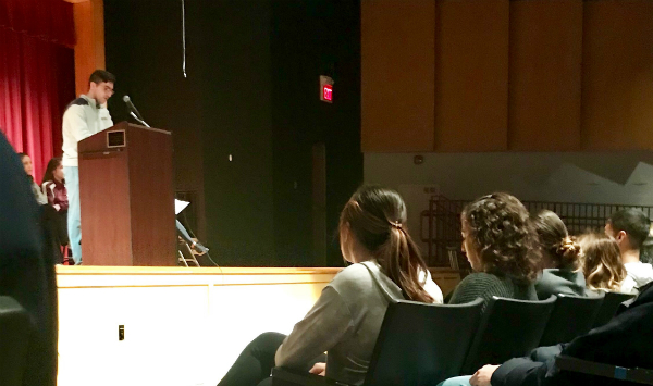 Student Council President Matthew Lussier leads the students of LHS at a memorial ceremony on March 14.