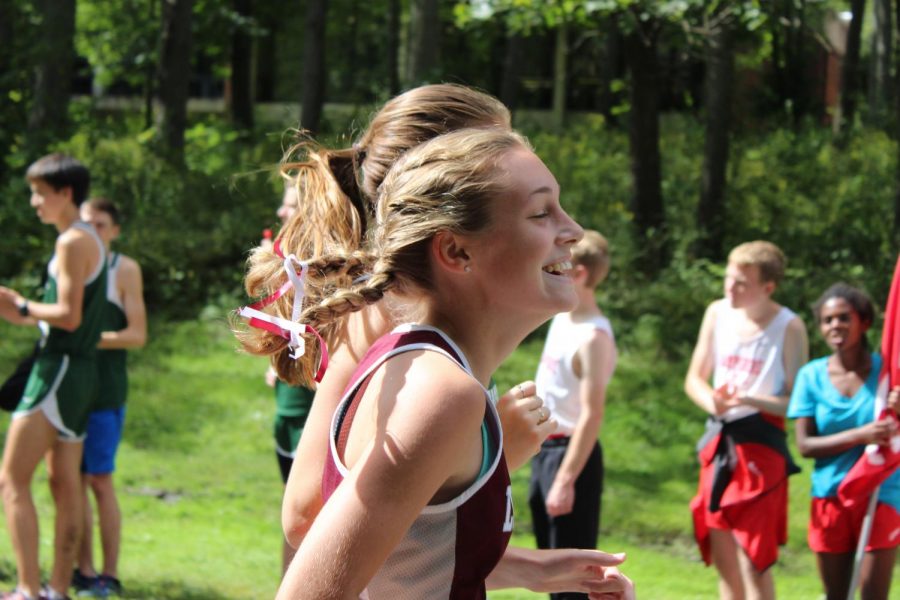 Senior Bridget Murphy caught laughing during her race