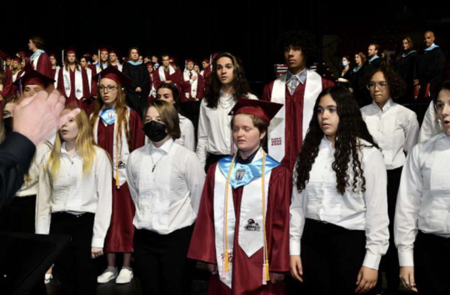 The LHS Chorus performs at the 2022 graduation ceremony at the Mullins Center.