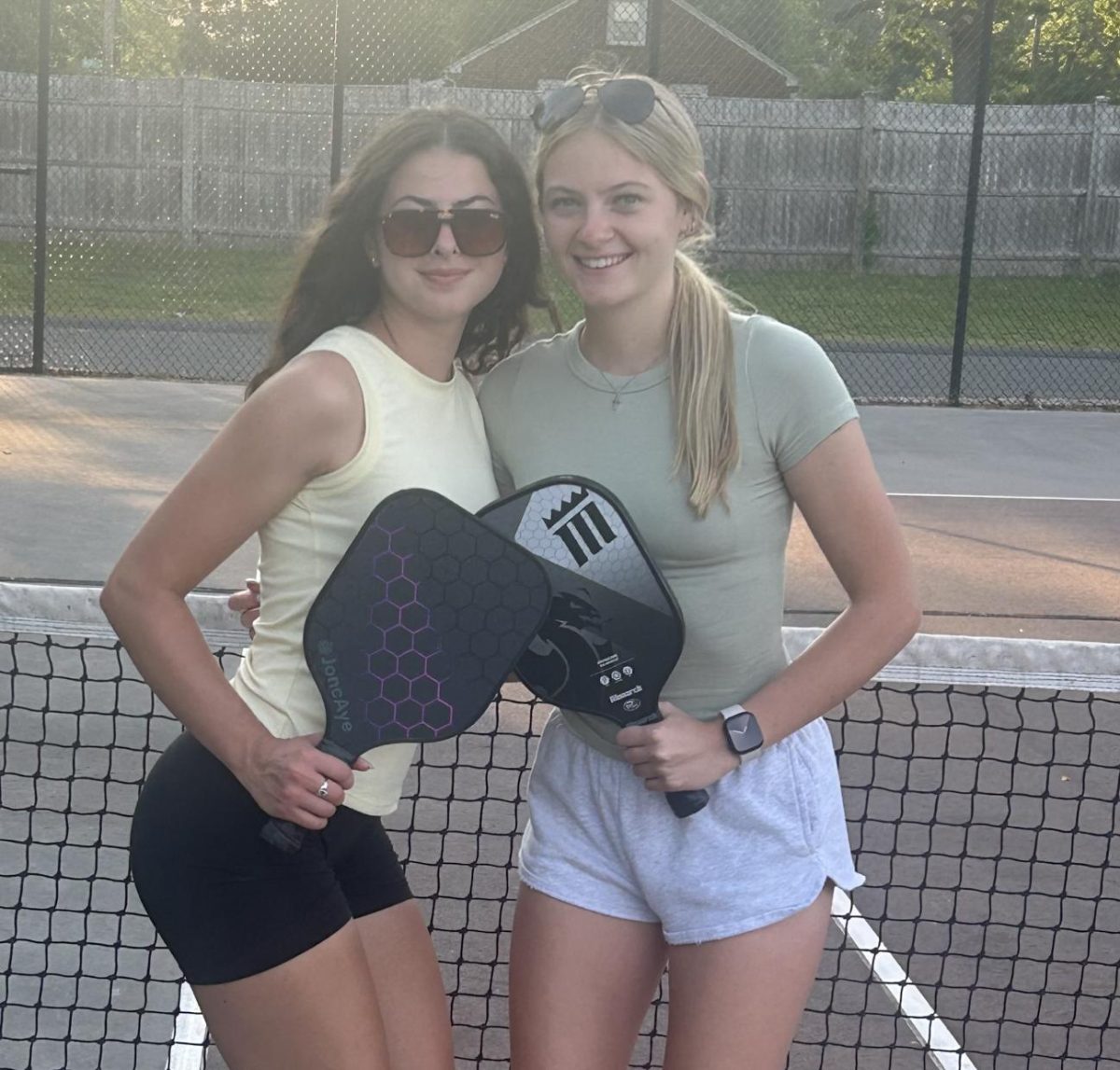 Juniors Gabby Gauvin and Ava Friese play pickle at Ludlow High School.
