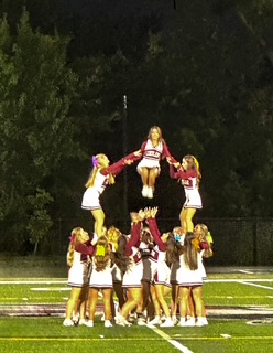 The cheer team performs impressive stunts during their halftime show
Edited by: Amanda Miller